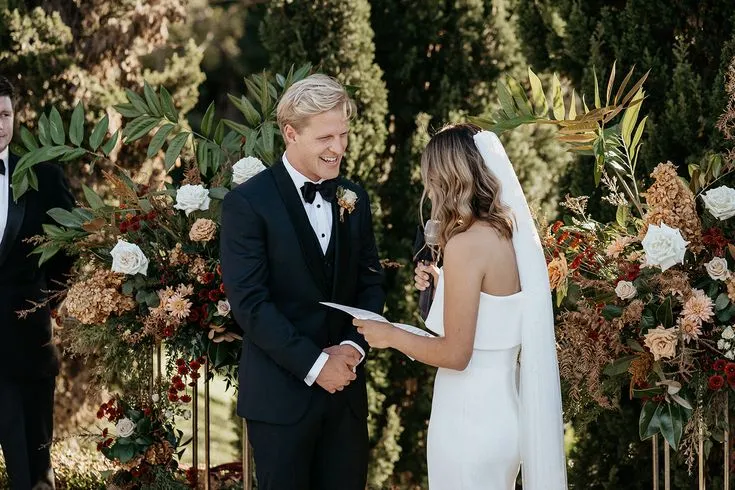 Bride and groom exchanging heartfelt vows in a stunning outdoor setting, a moment beautifully managed by an On the Day Wedding Coordinator Australia.